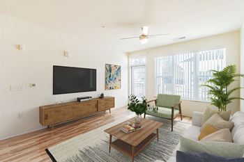 A living room with a flat screen tv and a wooden coffee table.